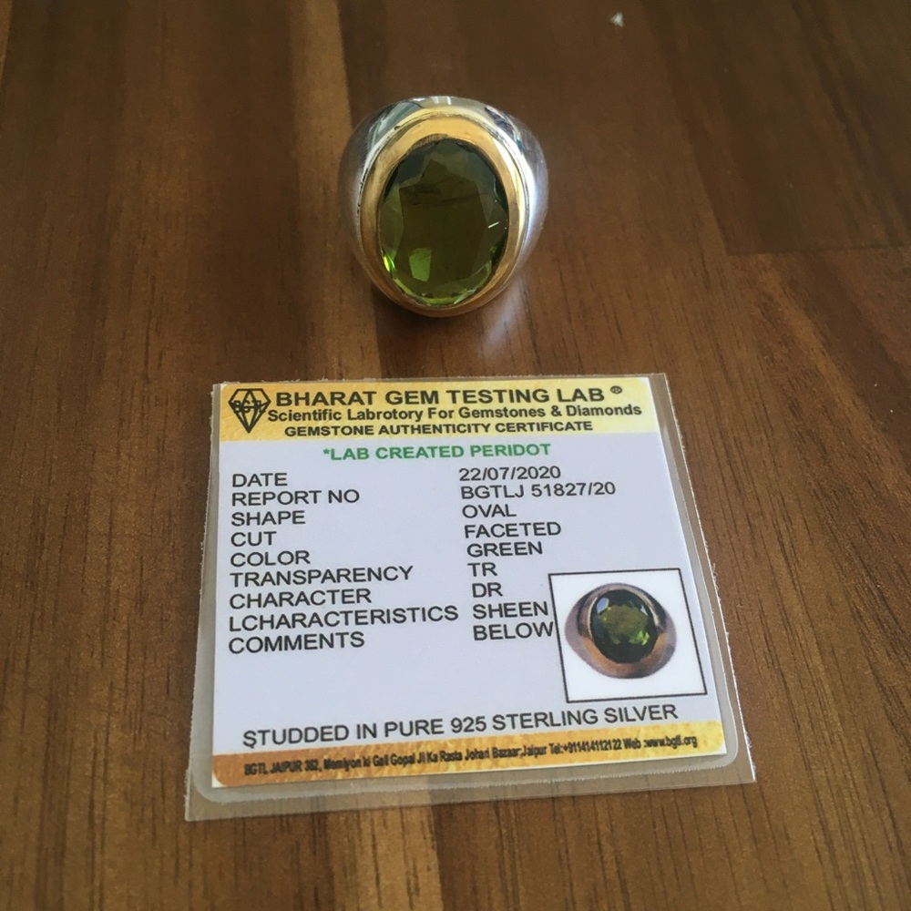 Green oval peridot ring faceted pure silver